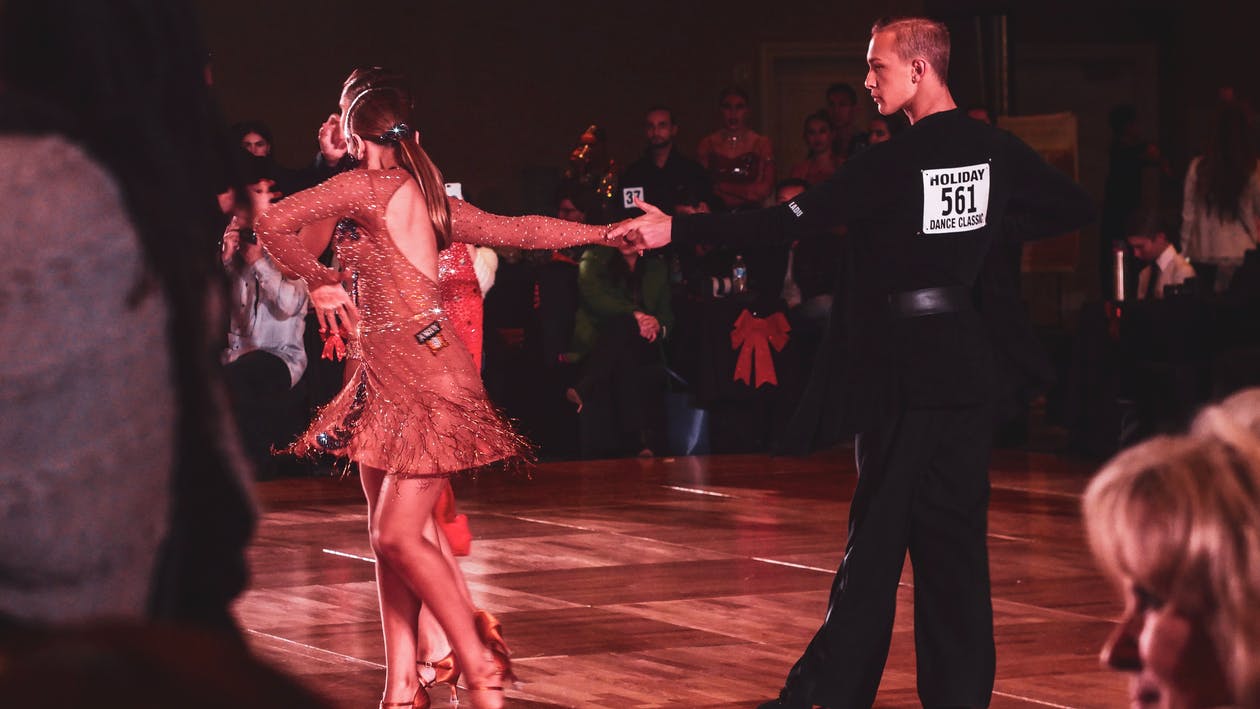 man and woman ballroom dancing